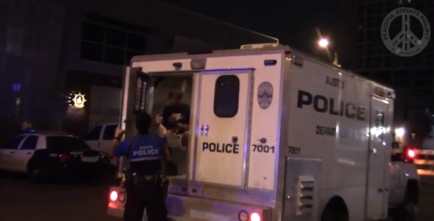Image: WATCH: Austin Police Officer Pepper Sprays Handcuffed Man Sitting in Police Van